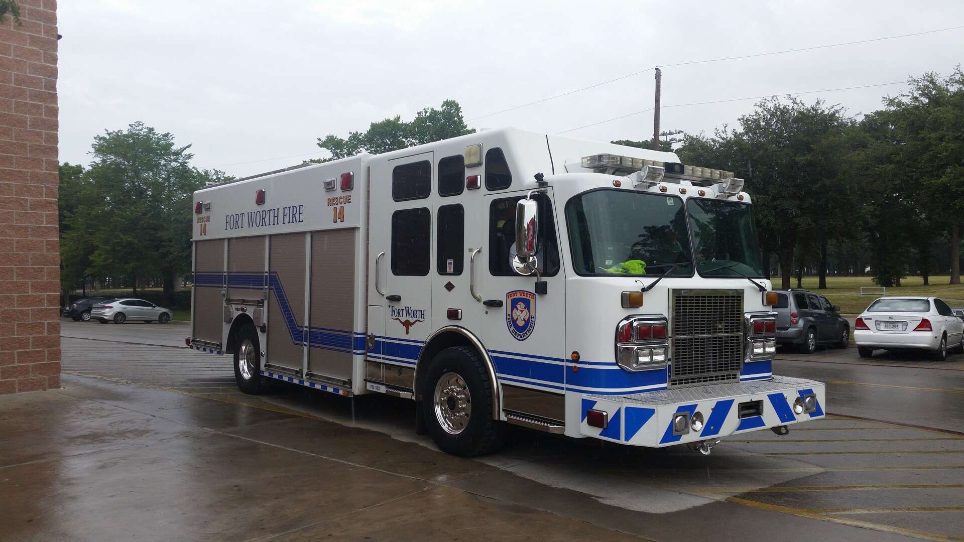 Fort Worth Fire Department Rescue 14 truck parked outside a fire station