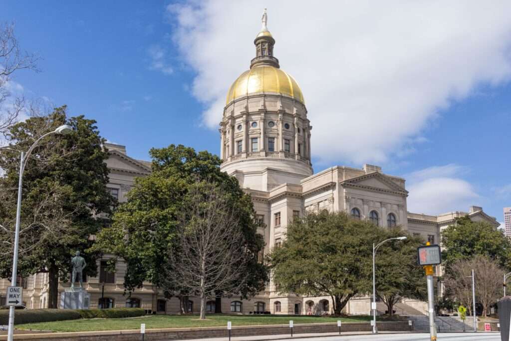Gold-domed Georgia State Capitol building in Atlanta under a blue sky