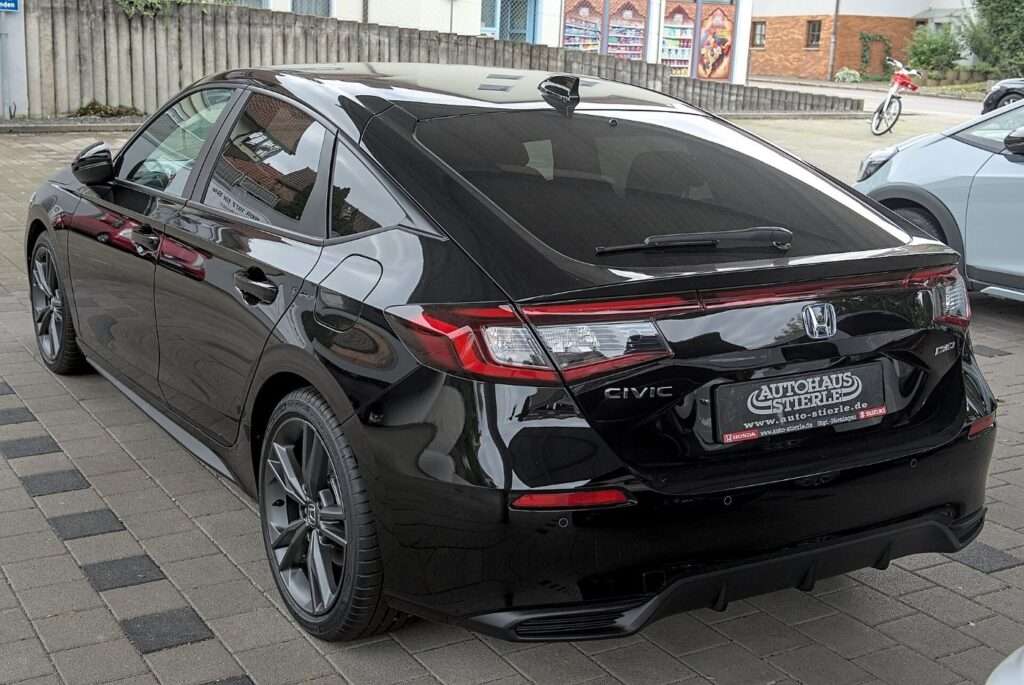 2025 Honda Civic hybrid hatchback parked on a street in Stuttgart