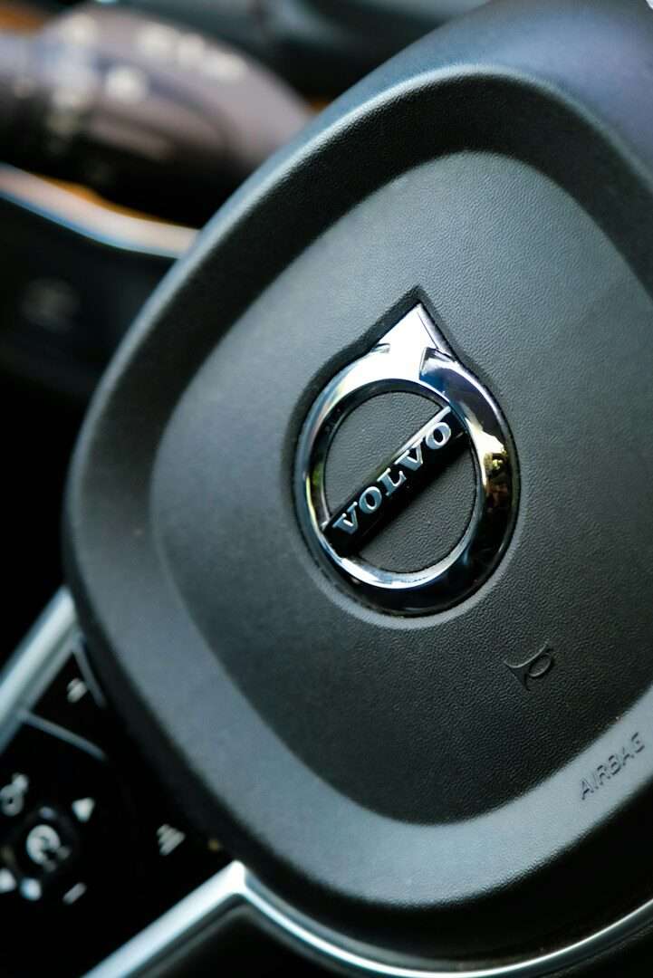 Close-up of a volvo steering wheel with logo