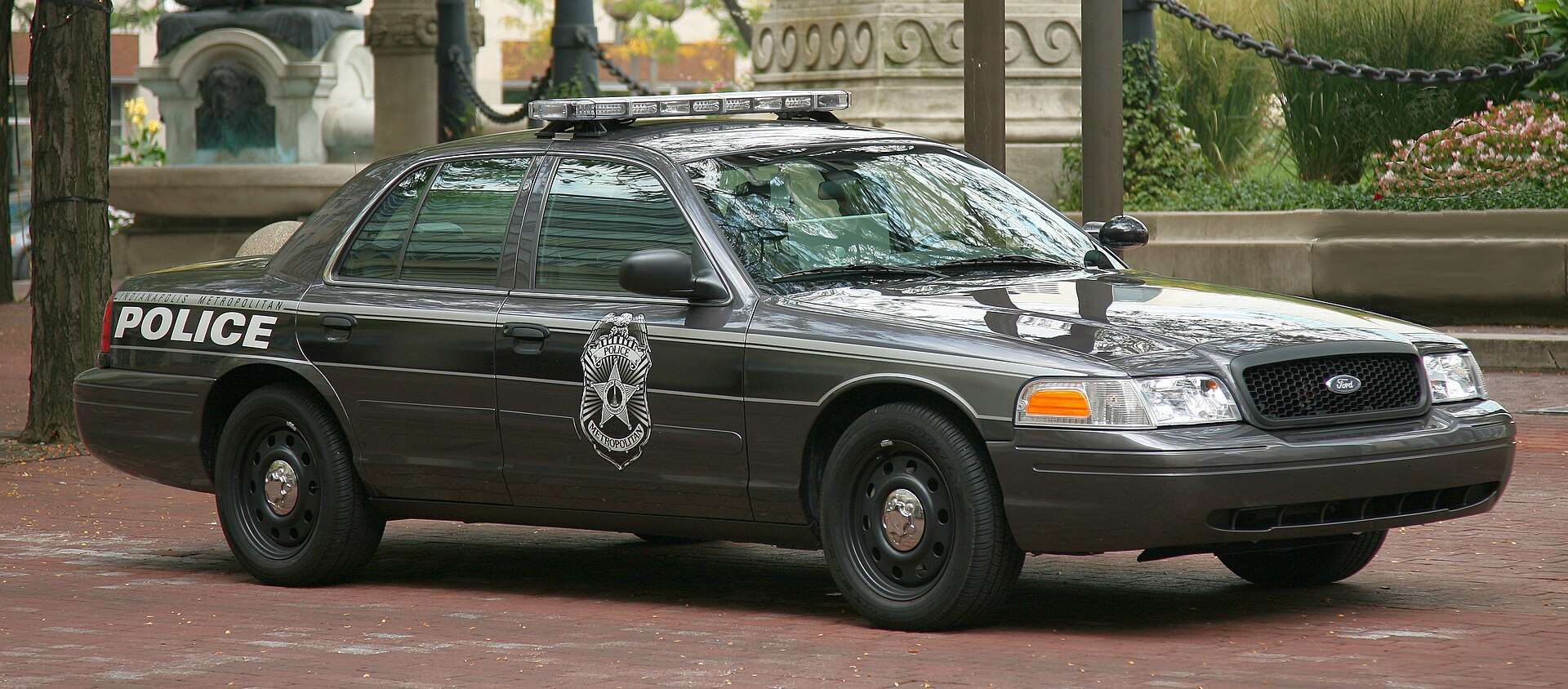 Gray Indianapolis Metropolitan Police Department Ford sedan parked near Monument Circle