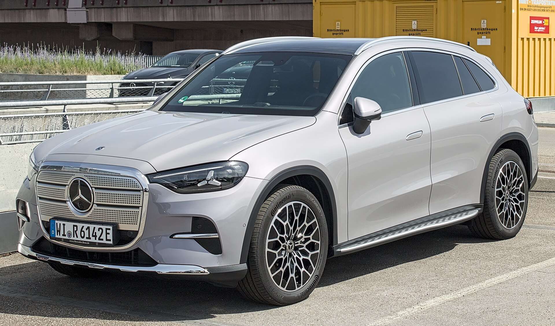Silver Mercedes-Benz GLC with EQ Technology electric SUV parked on a city street