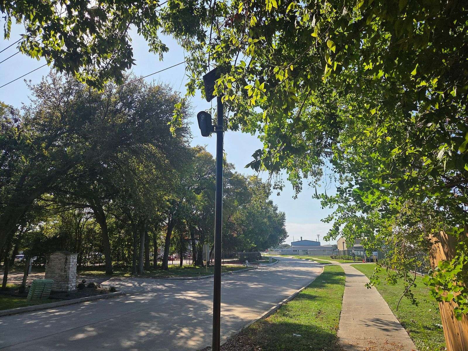 License plate reader camera on a pole beside a residential road