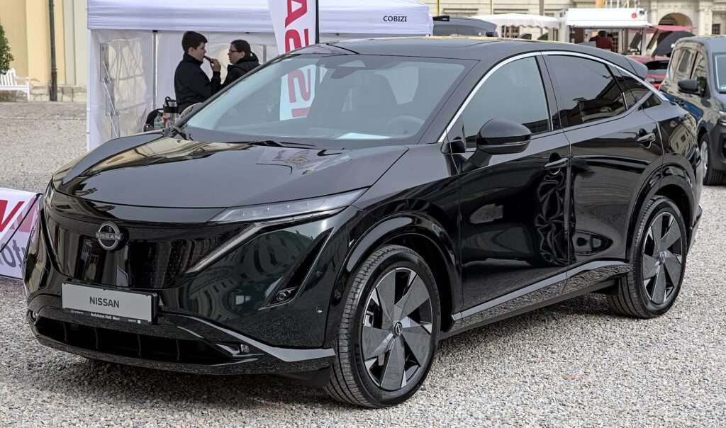 Black Nissan Ariya electric crossover at an auto show