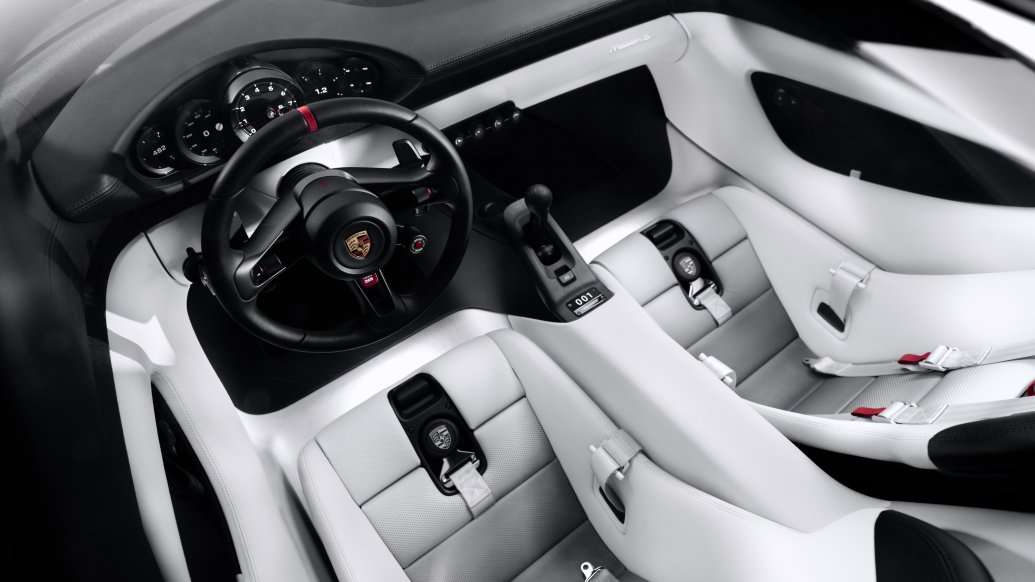 Porsche Mission S cockpit with five round gauges, a tall console lever and no center touchscreen