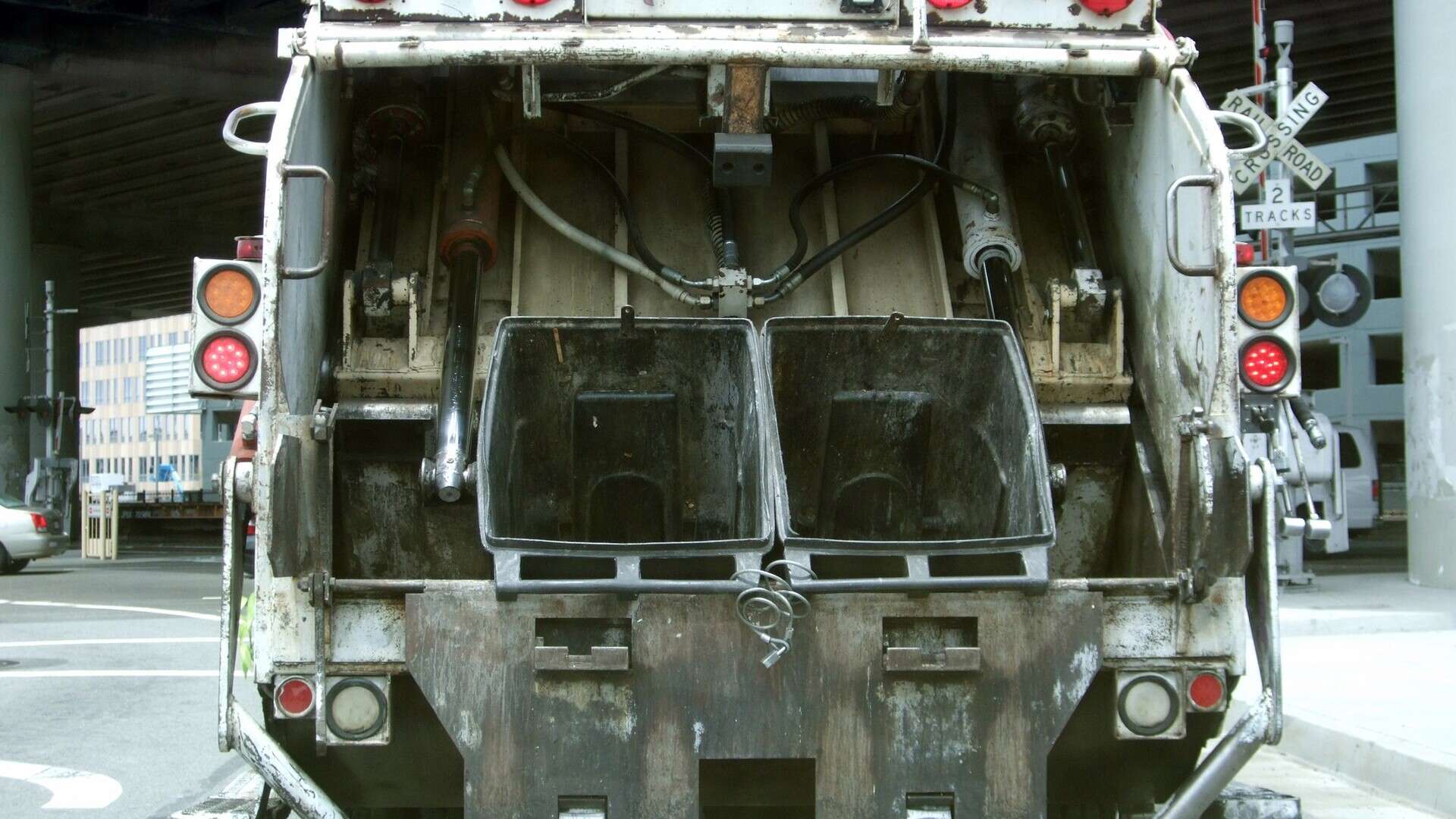 A municipal garbage truck parked on a street