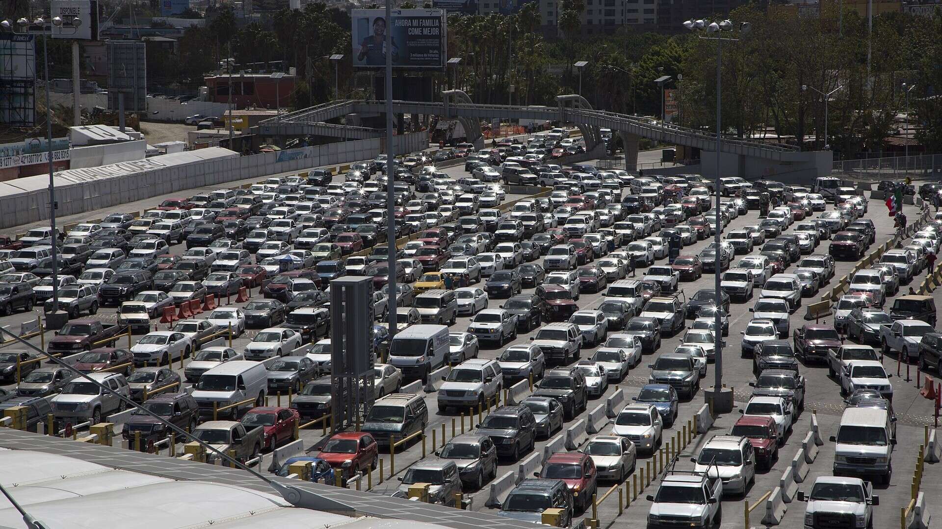 Rows of northbound vehicles waiting in inspection lanes at the San Ysidro Port of Entry between Tijuana and San Diego