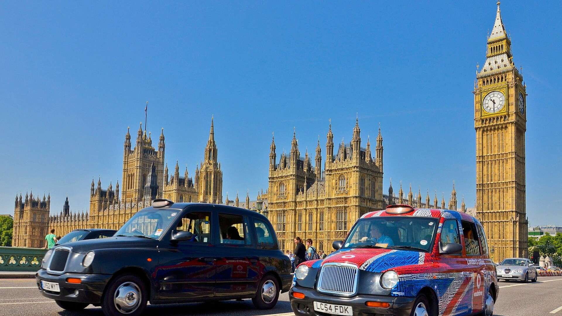 Two black cabs with Big Ben in the background