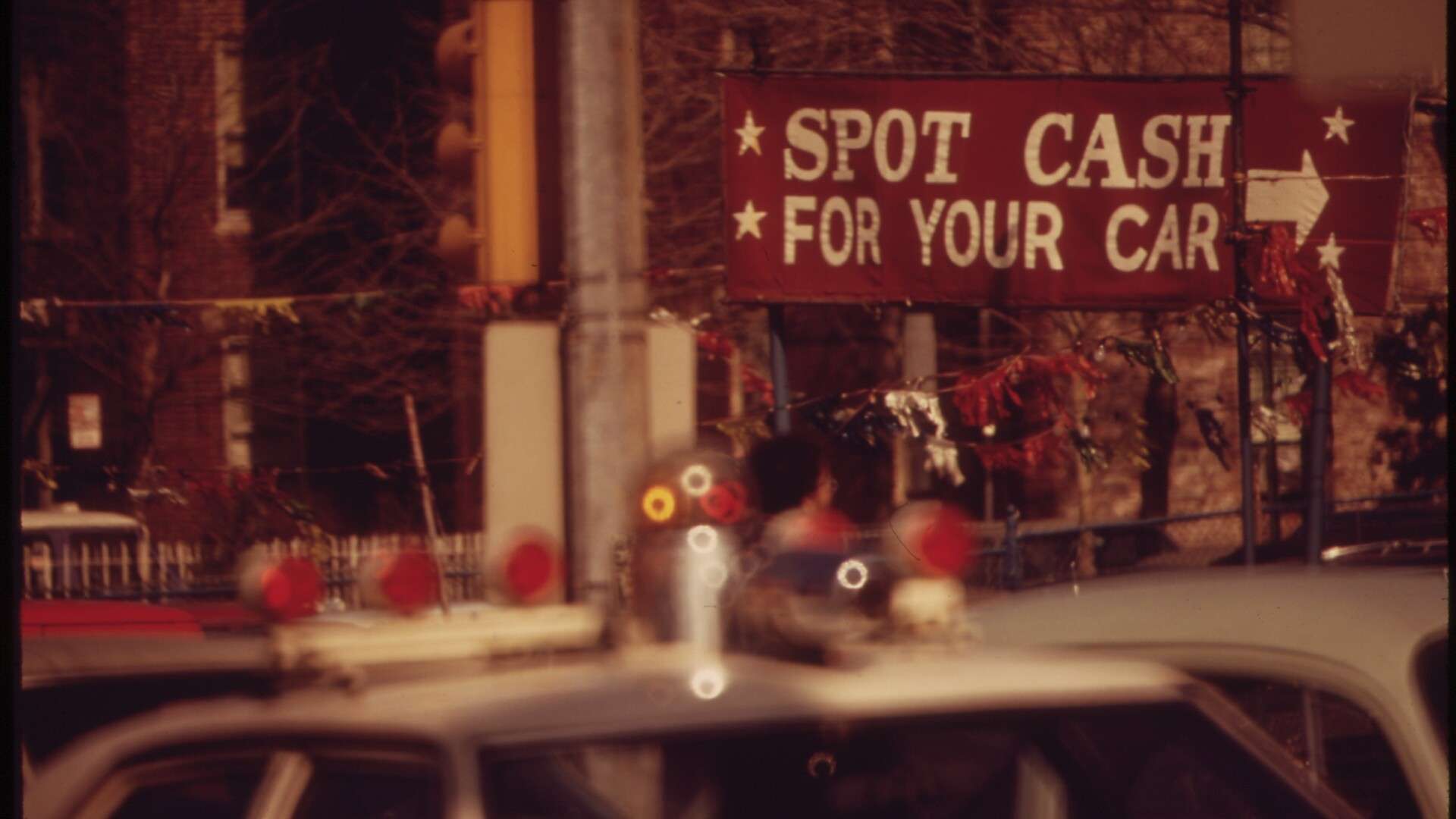 A small used car lot on Queens Boulevard in New York City, photographed in April 1973