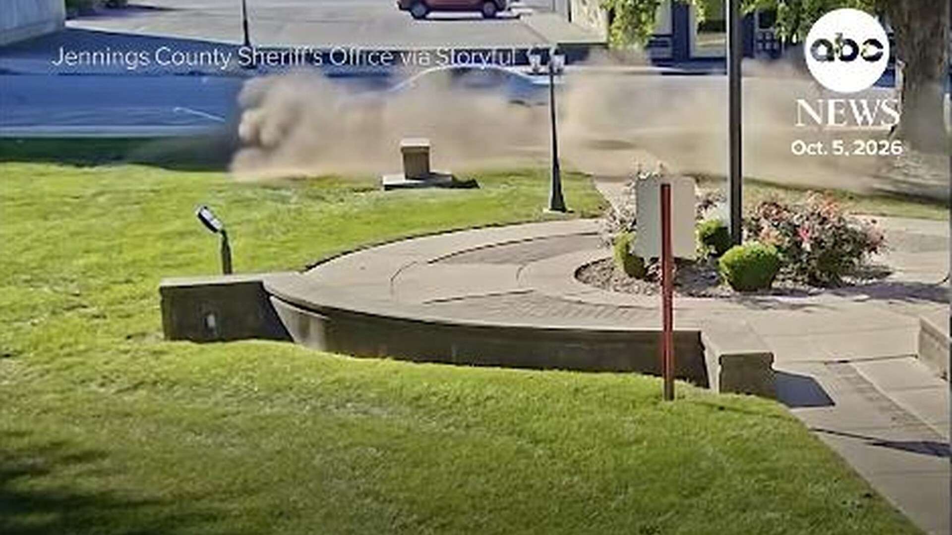 Surveillance video frame of dust kicked up by a car on the Jennings County Courthouse lawn in Vernon, Indiana